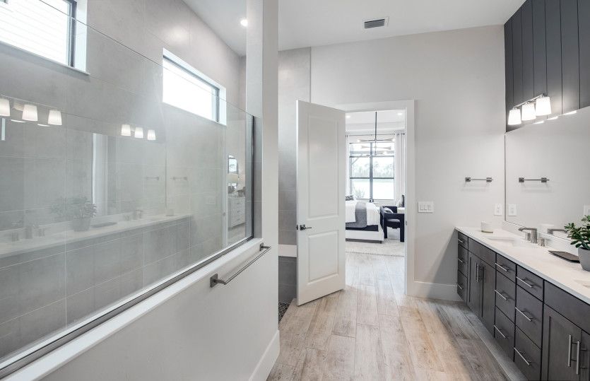 Walk-in shower located in owner's bath