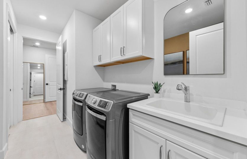 Spacious laundry room with optional sink and additional cabinets - perfect for storage