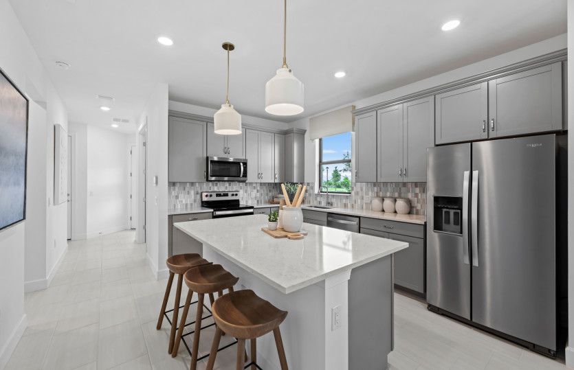 Kitchen with large center island and stainless steel appliances
