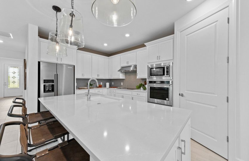 Kitchen with center island and stainless steel appliances