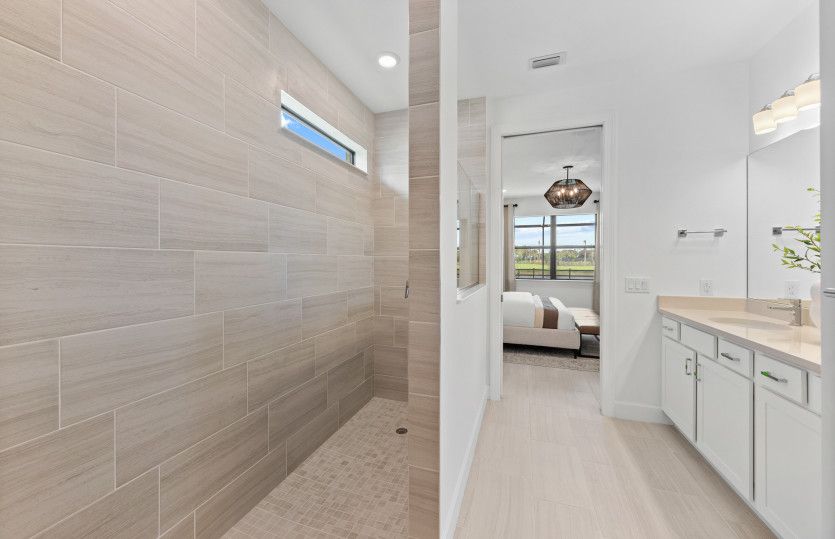 Owner's bath with large walk-in shower and space for a vanity