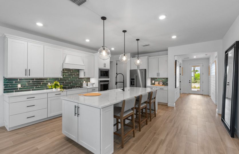 Kitchen with stainless steel appliances with large center island