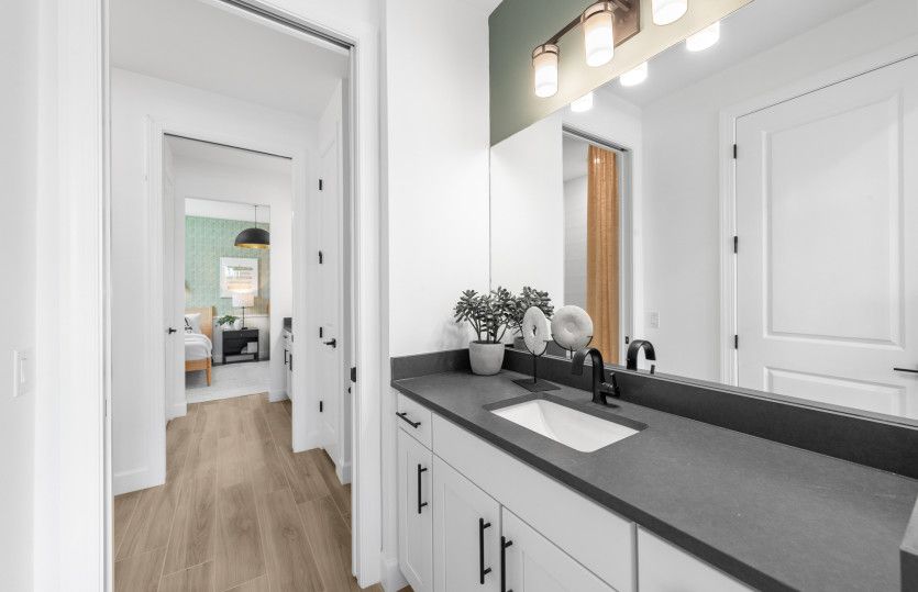 Jack and Jill style bathroom with private sinks