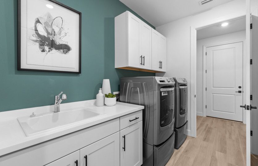 Large laundry room with a flow through layout