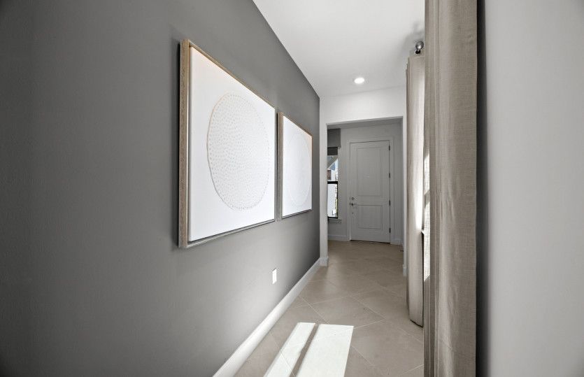 Natural light floods in from the numerous windows in this home design