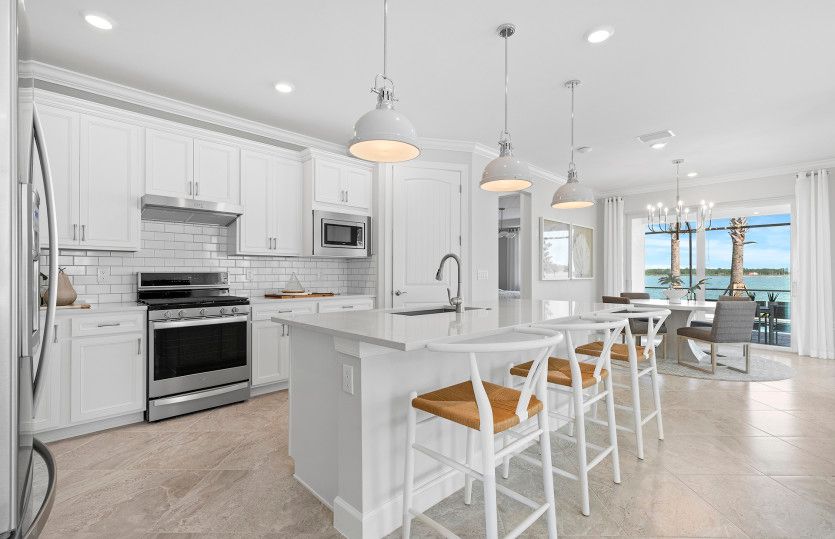 Gourmet kitchen with center island and stainless steel appliances