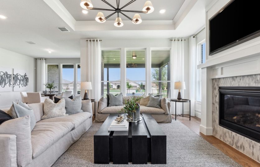 Spacious gathering room with large windows offering natural light