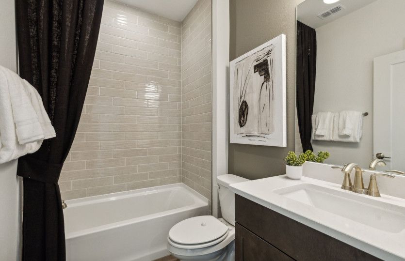 Spacious secondary bathroom*model representation