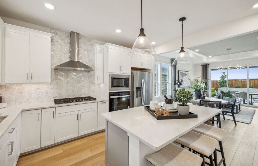 Spacious kitchen with pendant lighting