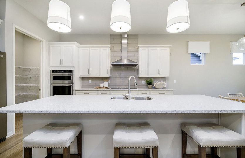 Sleek finishes and a stylish cooking haven.