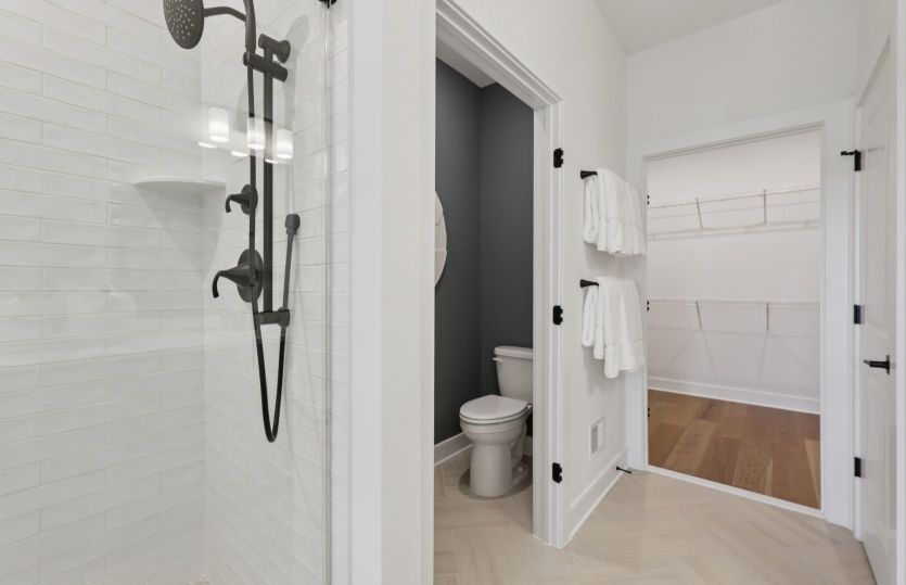 Luxurious Owner's Bath with Access to One of the Walk-In Closets