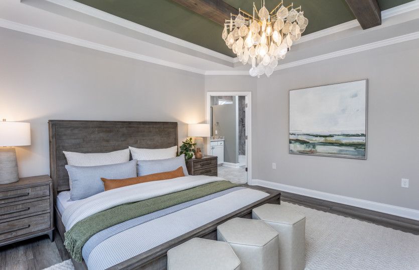 Timeless Design with Tray Ceilings & Wooden Beams