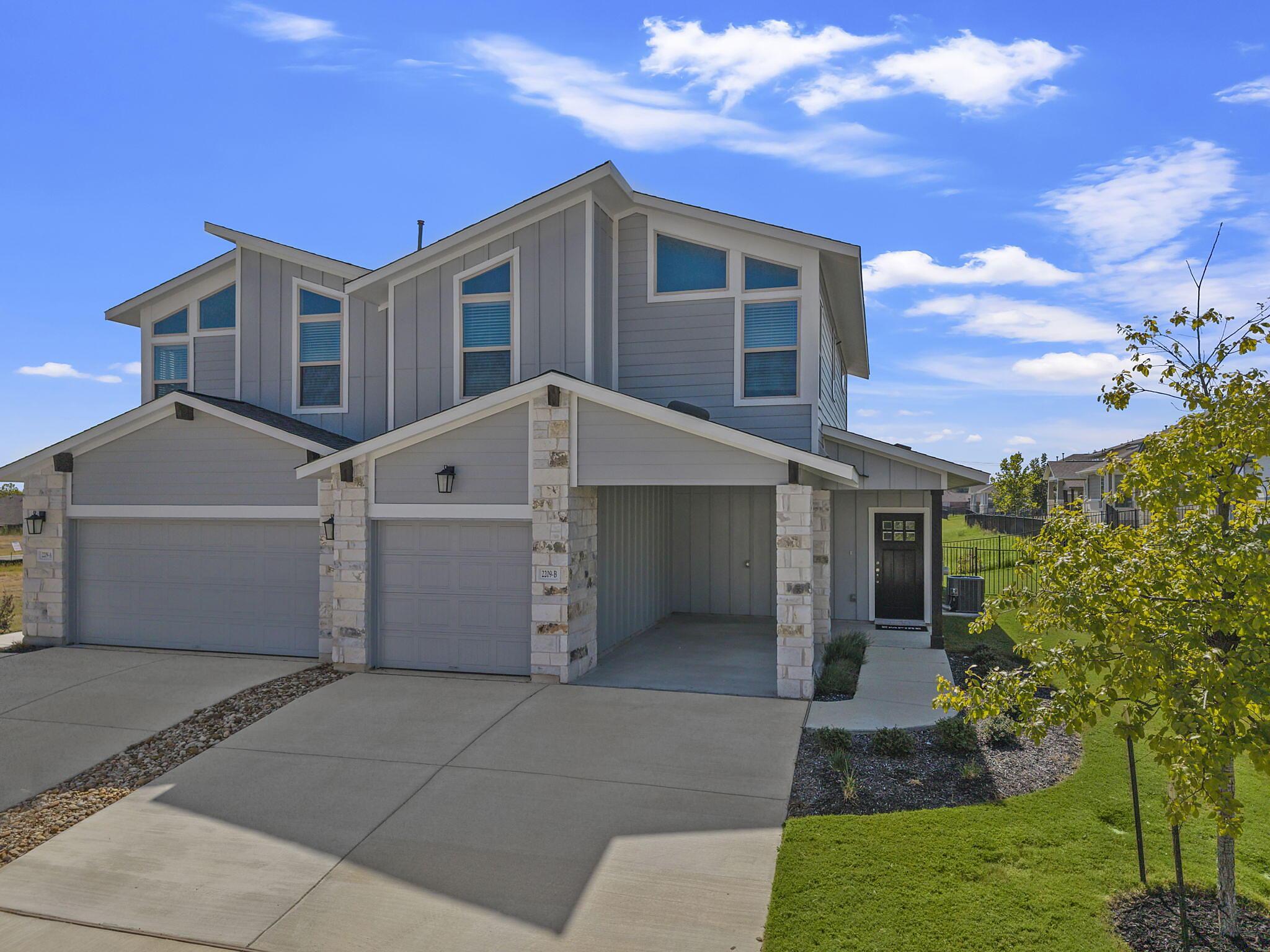 Magnolia: Carport - Villas at Rowe: Pflugerville, Texas - Empire Homes