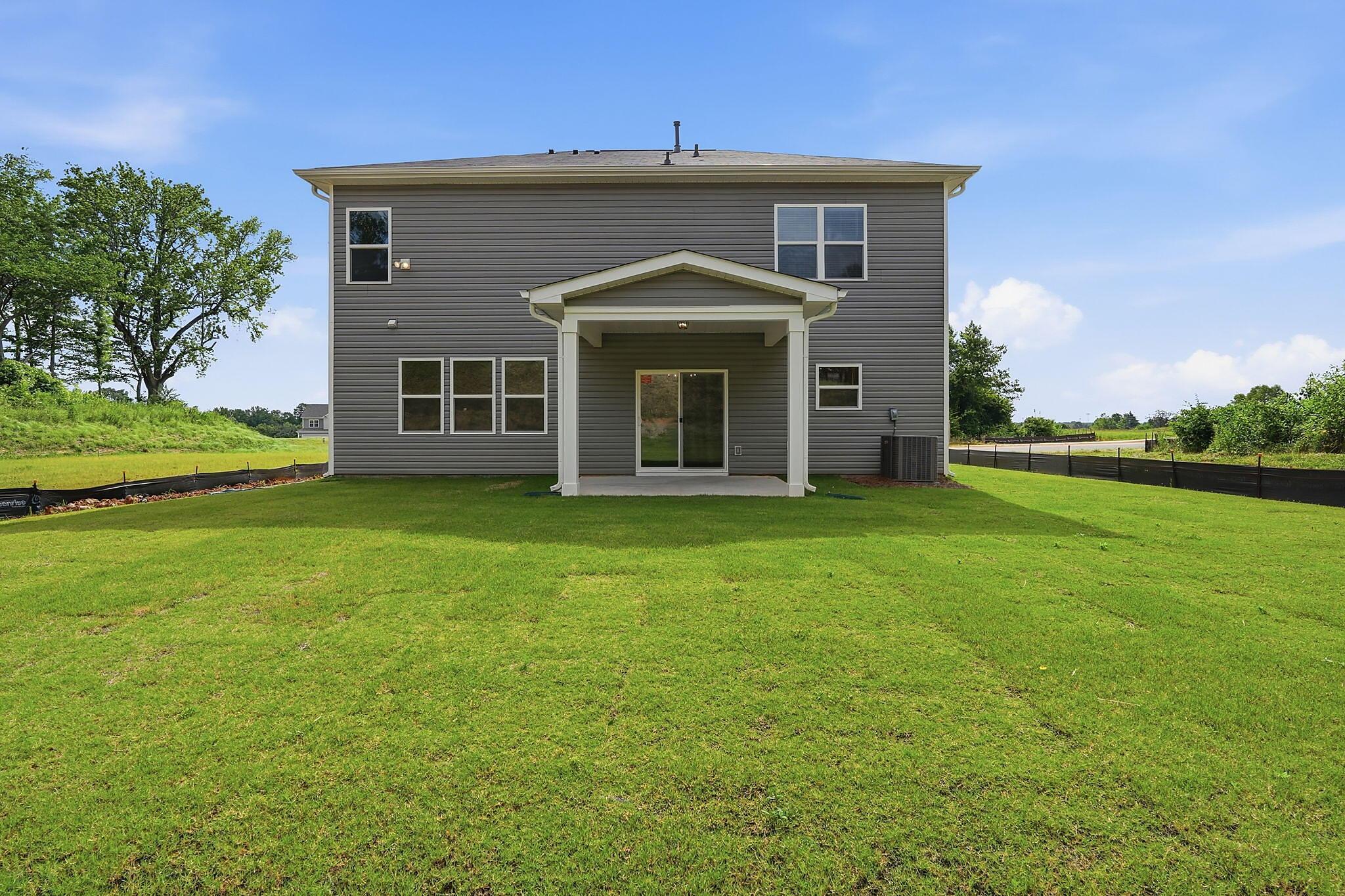 Back of Home with Covered Patio