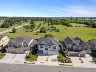 The Abbey: Carport - Villas at Rowe: Pflugerville, Texas - Empire Homes