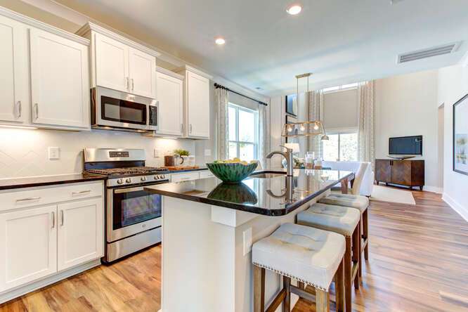 casa en Kensington Place Townhomes por Eastwood Homes