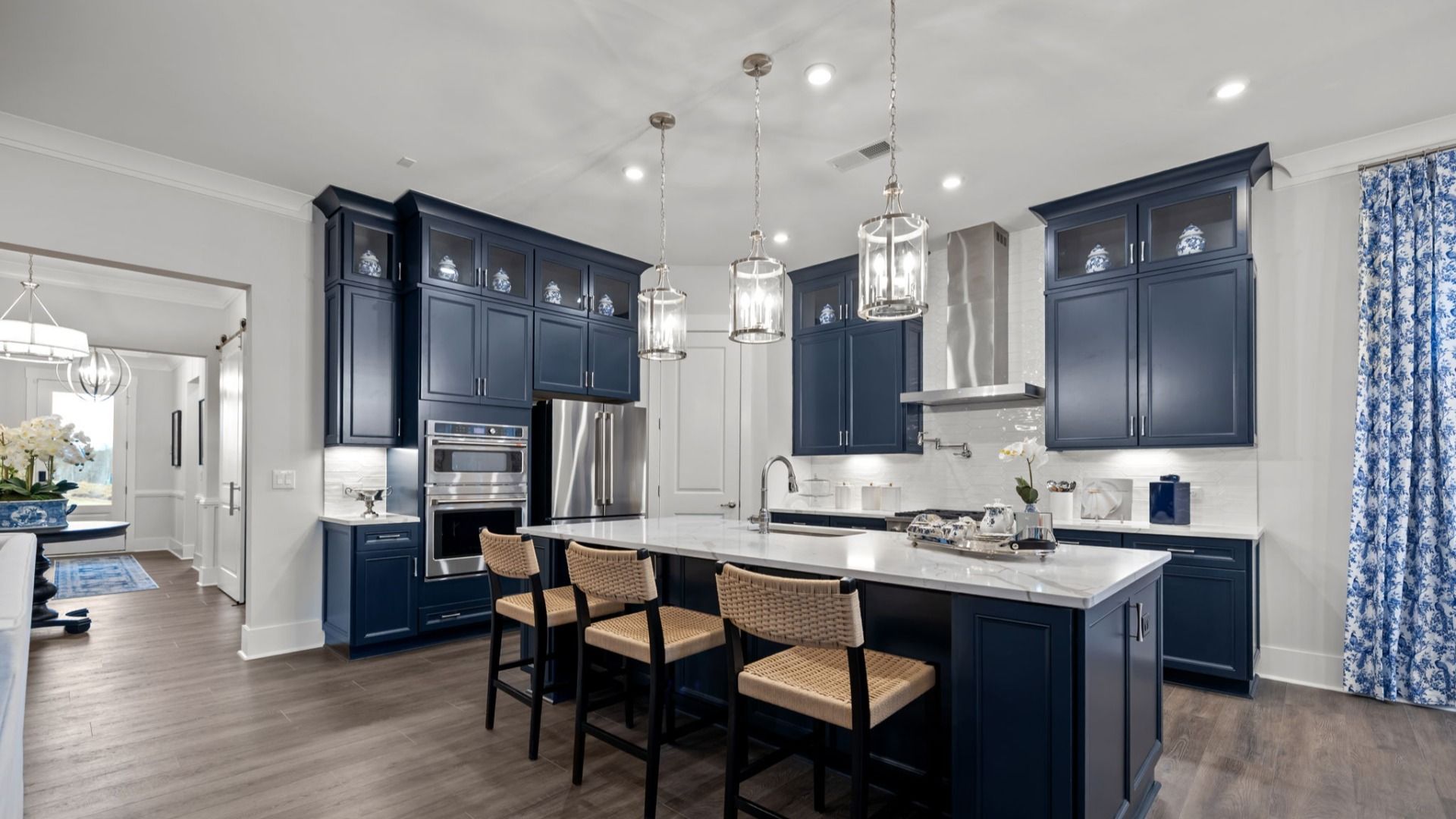 The Adventurer Plan by DBR Homes kitchen with blue cabinets and modern features in Fort Mill, SC.
