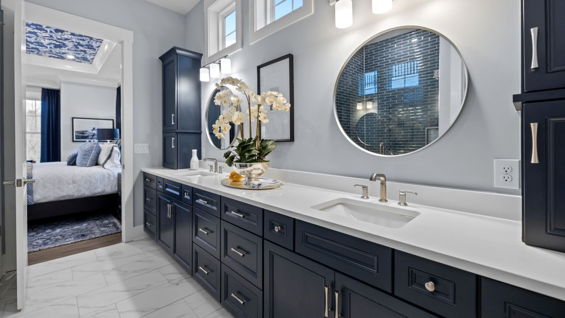 The Adventurer Plan with a modern bathroom featuring a glass-enclosed shower lined with rich navy blue tiles in Fort Mill, SC