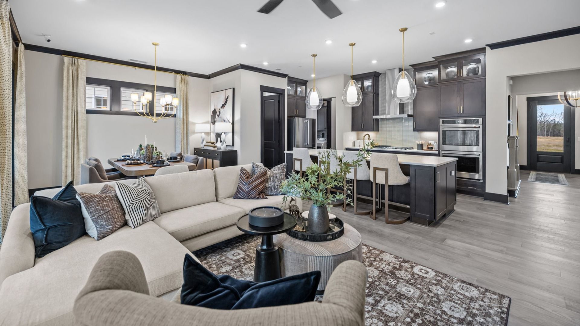 The Enthusiast Plan by DBR Homes kitchen and living area with modern features in Fort Mill, SC.