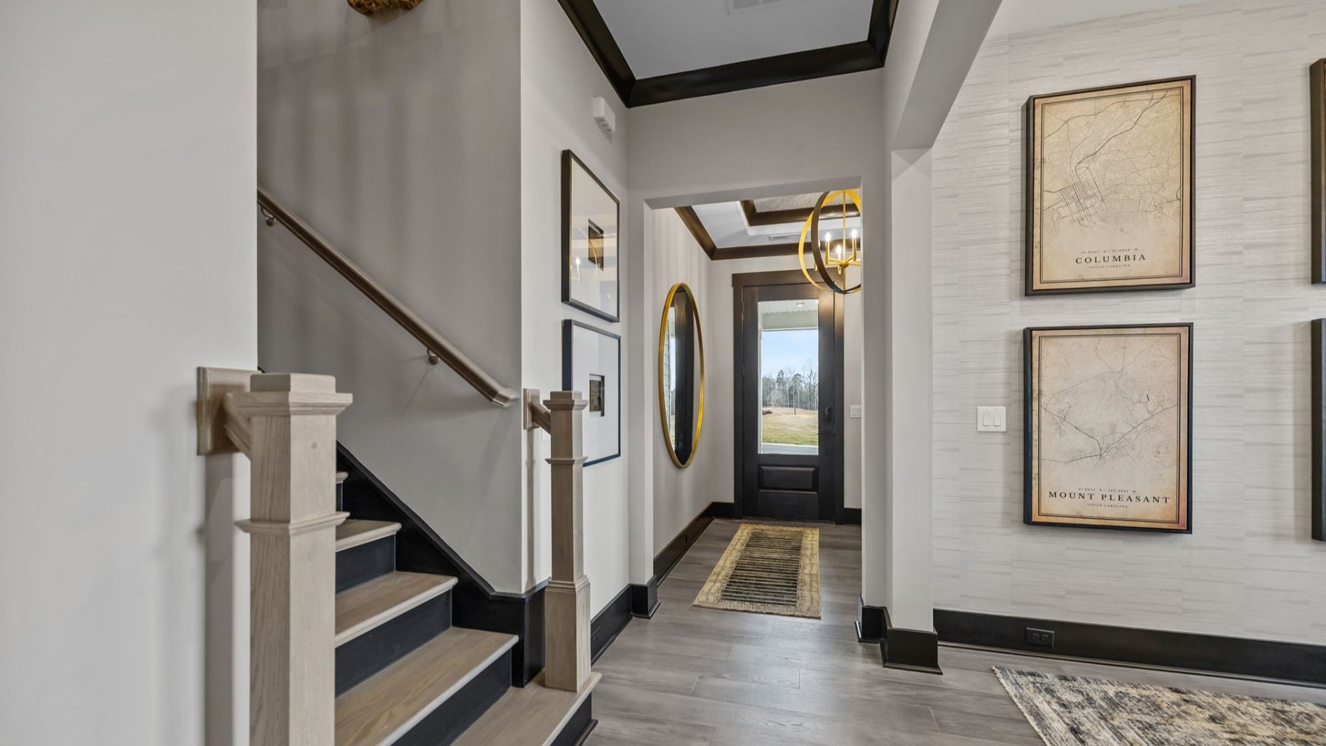 The Enthusiast Plan by DBR Homes a bright and welcoming home entryway in Fort Mill, SC