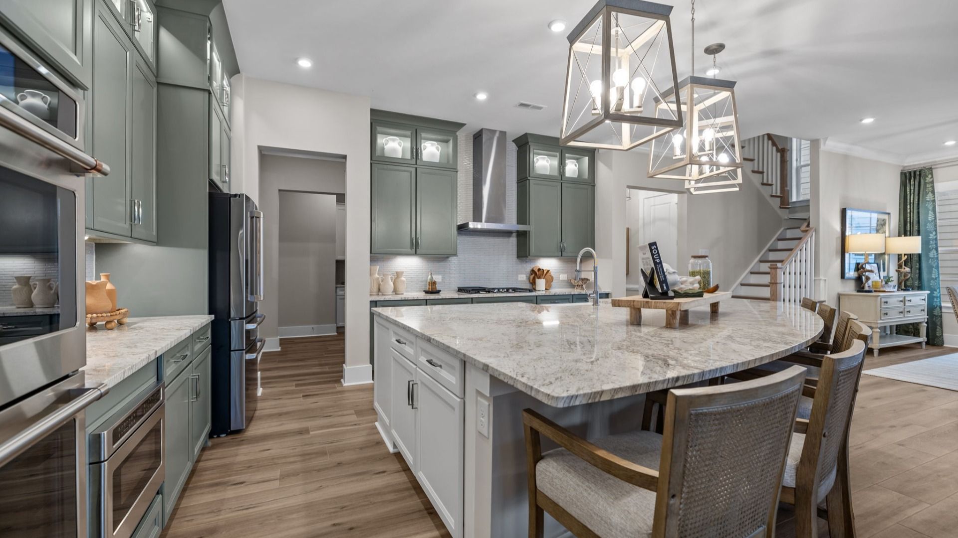 The Inspire Plan by DBR Homes kitchen with an oversized corner island modern cabinets and features in Fort Mill, SC.