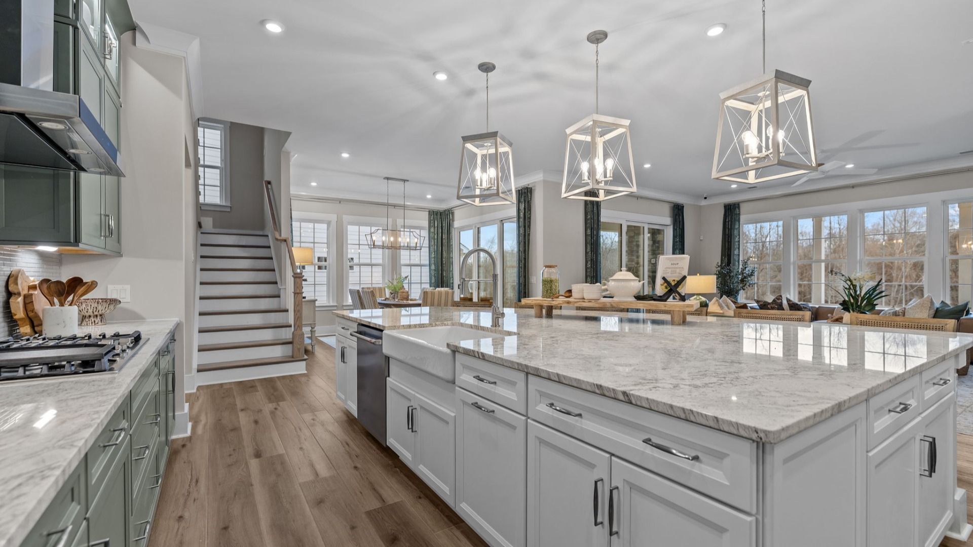 The Inspire Plan by DBR Homes kitchen with an oversized corner island modern cabinets and features in Fort Mill, SC.