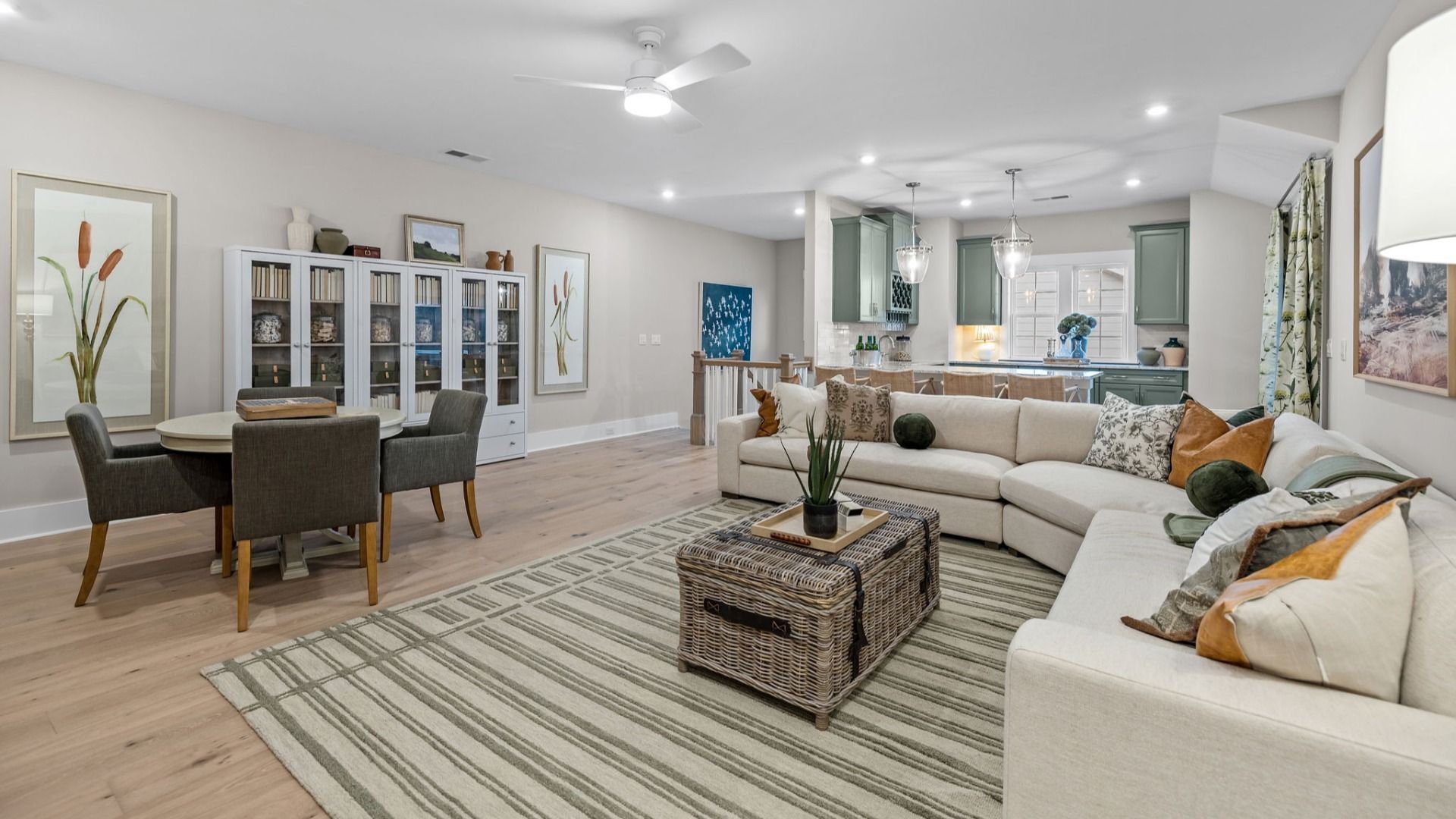 The Inspire Plan by DBR Homes upstairs loft featuring a compact bar kitchen with sleek cabinetry in Fort Mill, SC