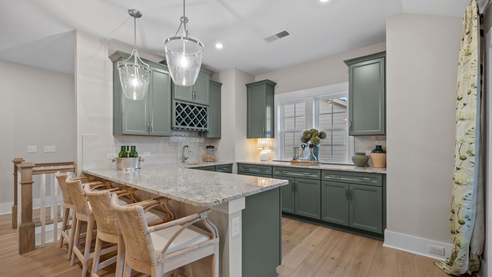 The Inspire Plan by DBR Homes upstairs loft featuring a compact bar kitchen with sleek cabinetry in Fort Mill, SC