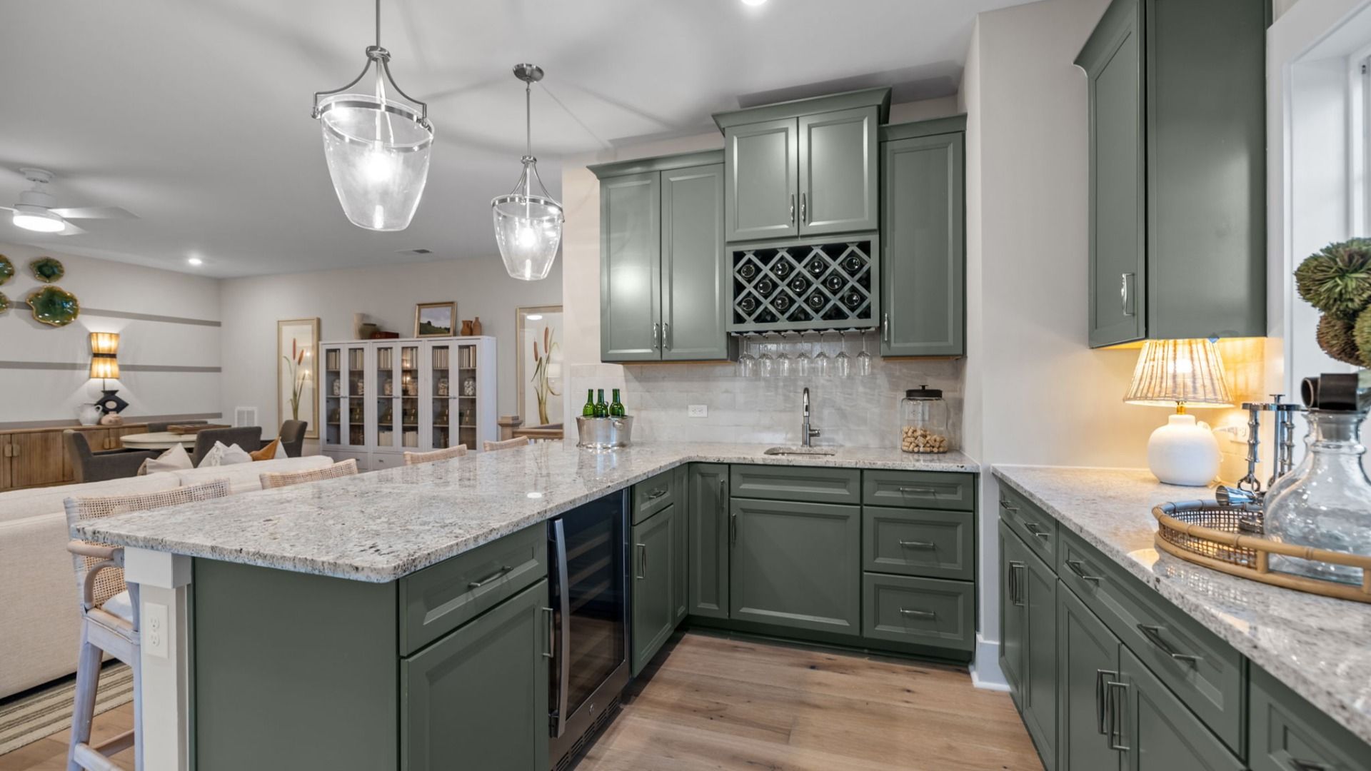 The Inspire Plan by DBR Homes upstairs loft featuring a compact bar kitchen with sleek cabinetry in Fort Mill, SC