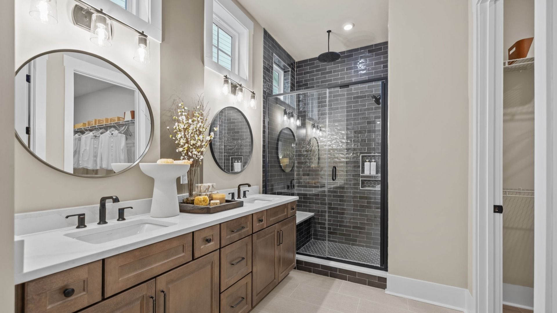 The Virtuoso Plan by DBR Homes with a luxury bathroom featuring a glass-enclosed shower with grey tiles in Fort Mill, SC