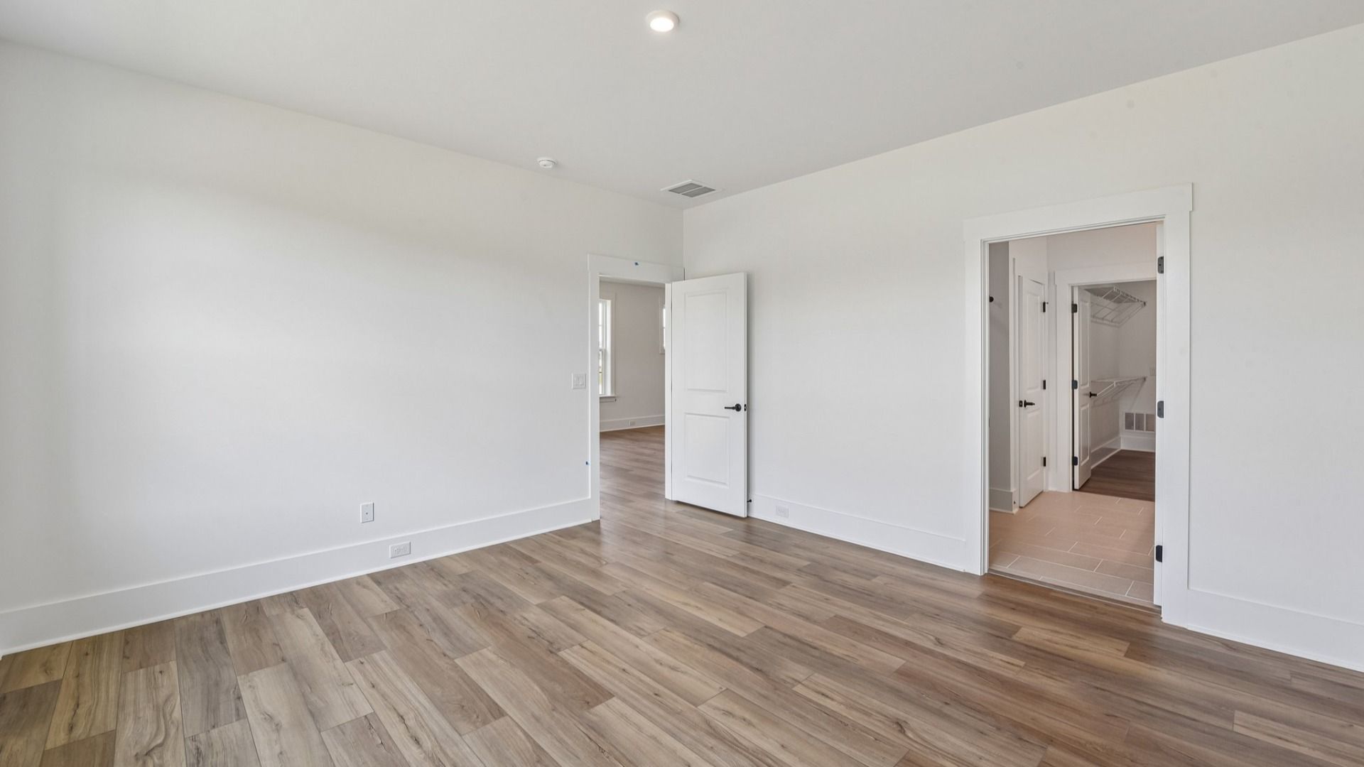 The Awaken Plan in Brook Run, Fort Mill SC - Primary Bedroom connected to Primary bath, walk-in closet and Laundry