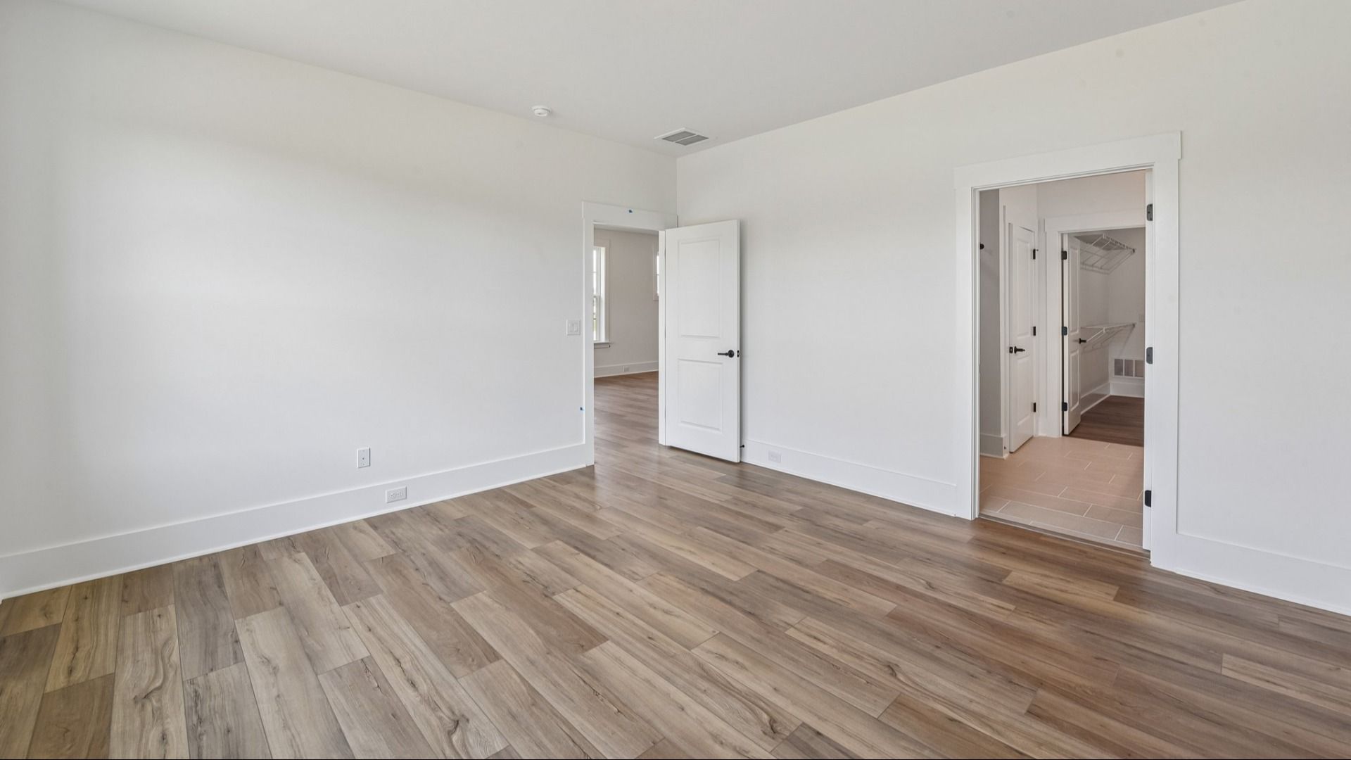 The Awaken Plan in Brook Run, Fort Mill SC - Primary Bedroom connected to Primary bath, walk-in closet and Laundry