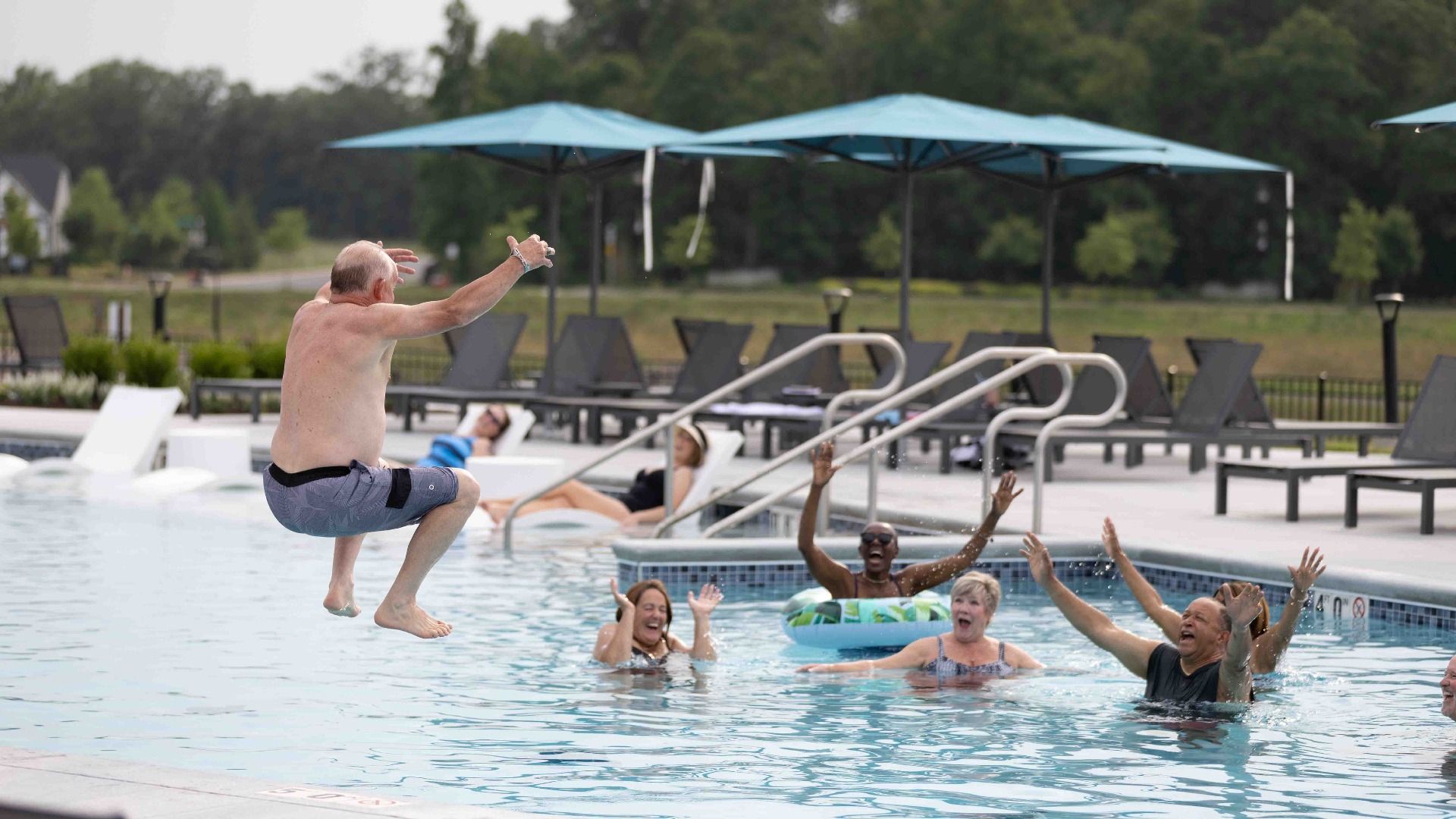 Soak up the sun and relax with neighbors by the sparkling outdoor pool.