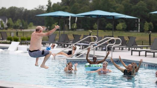Soak up the sun and relax with neighbors by the sparkling outdoor pool.