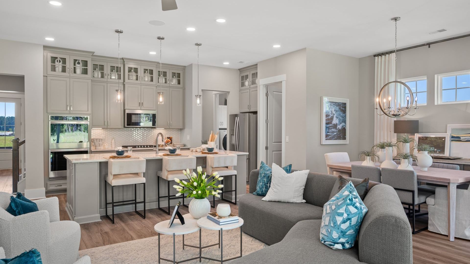 Living room of the Enthusiast floorplan at Summerwind Crossing at Lakes of Cane Bay features an open concept