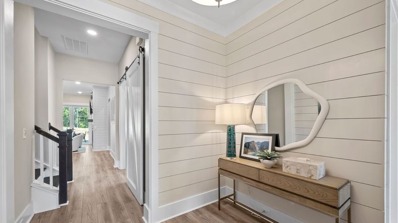 Foyer of the Enthusiast floorplan at Summerwind Crossing at Lakes of Cane Bay features high ceilings and an open layout