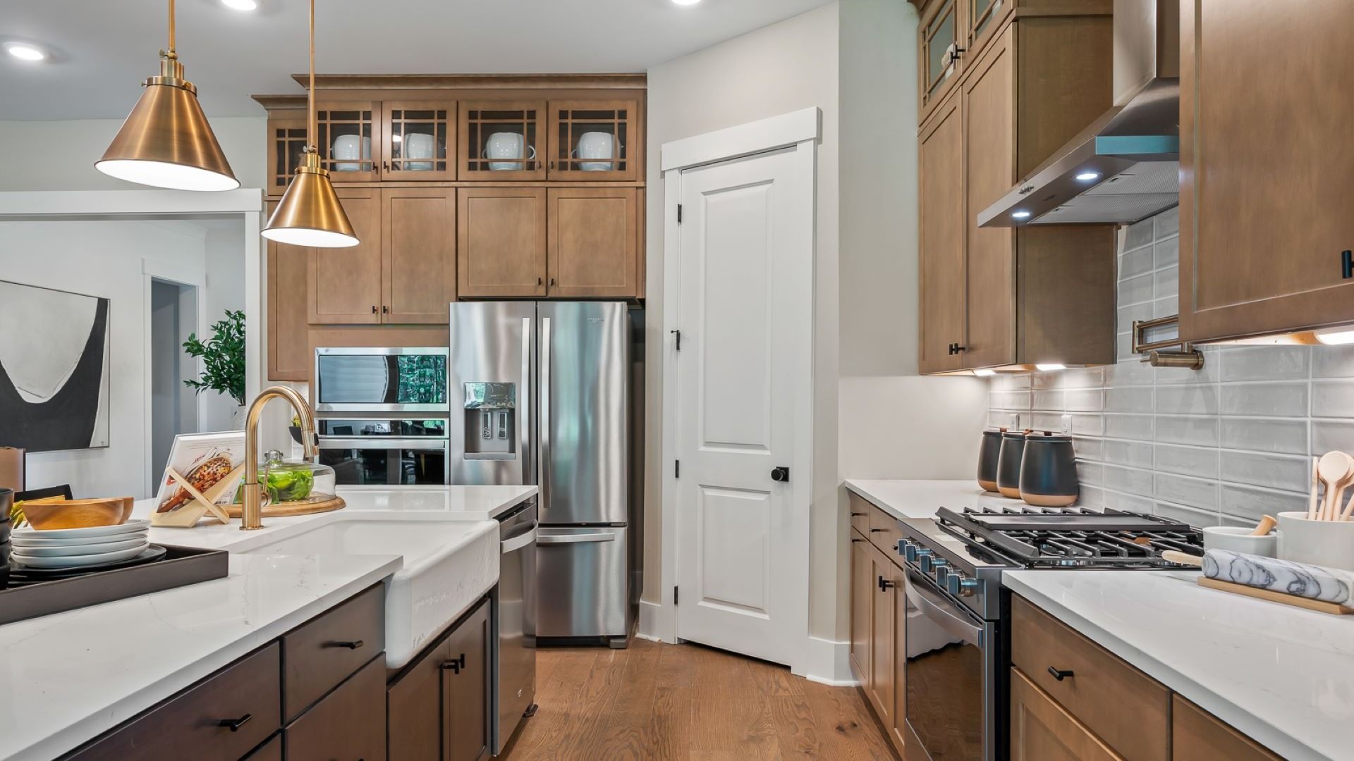 New model home Adventurer in Summerwind Crossing at Lakes of Cane Bay features a Chef's kitchen with farmhouse sink
