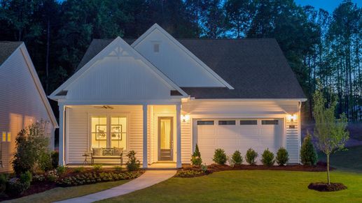 The DRB Elevate Curator floor plan shines at night, showcasing its elegant exterior at all times.
