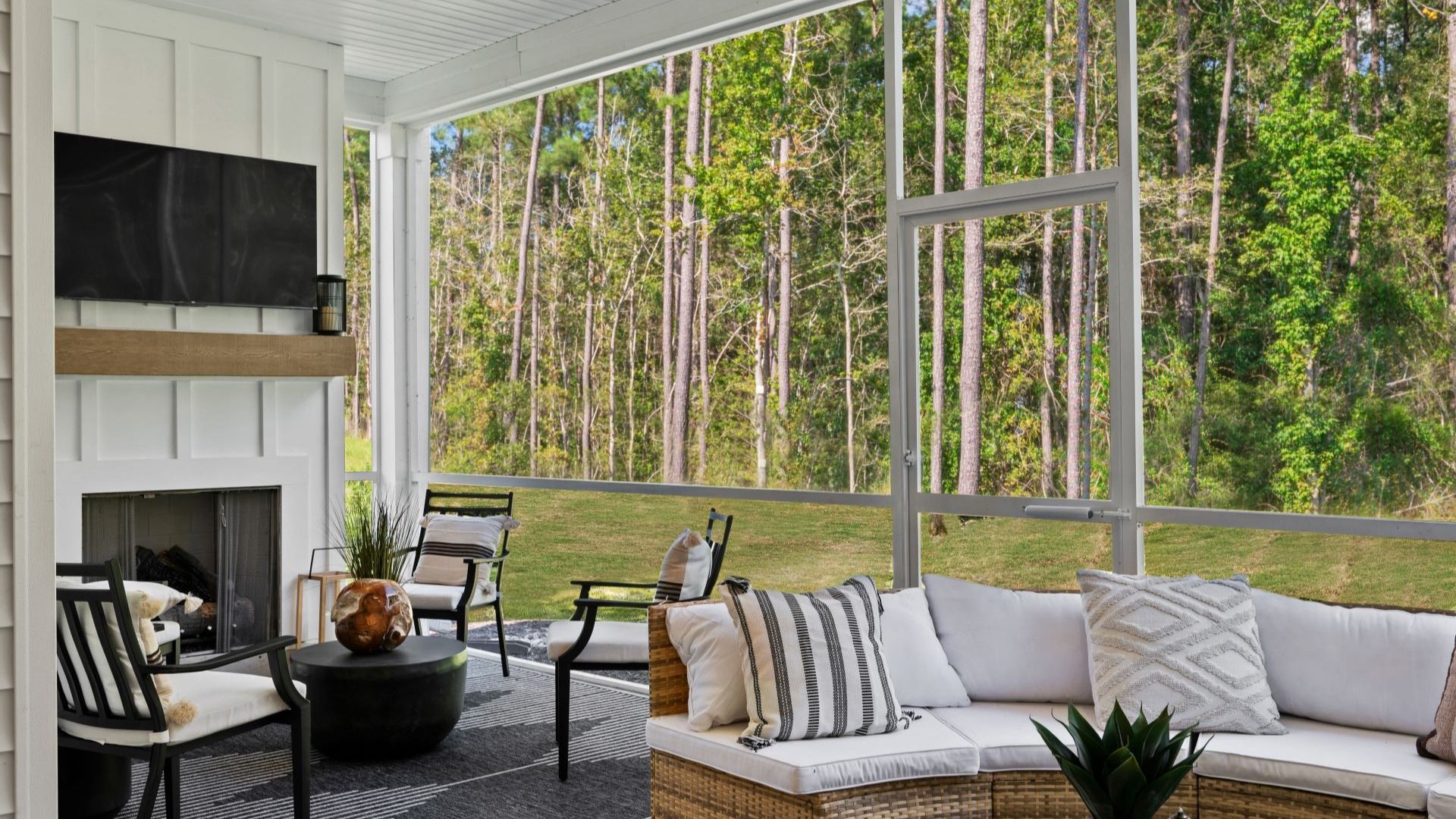 Patio of the Enthusiast floorplan at Summerwind Crossing at Lakes of Cane Bay features an open view and an electric fireplace