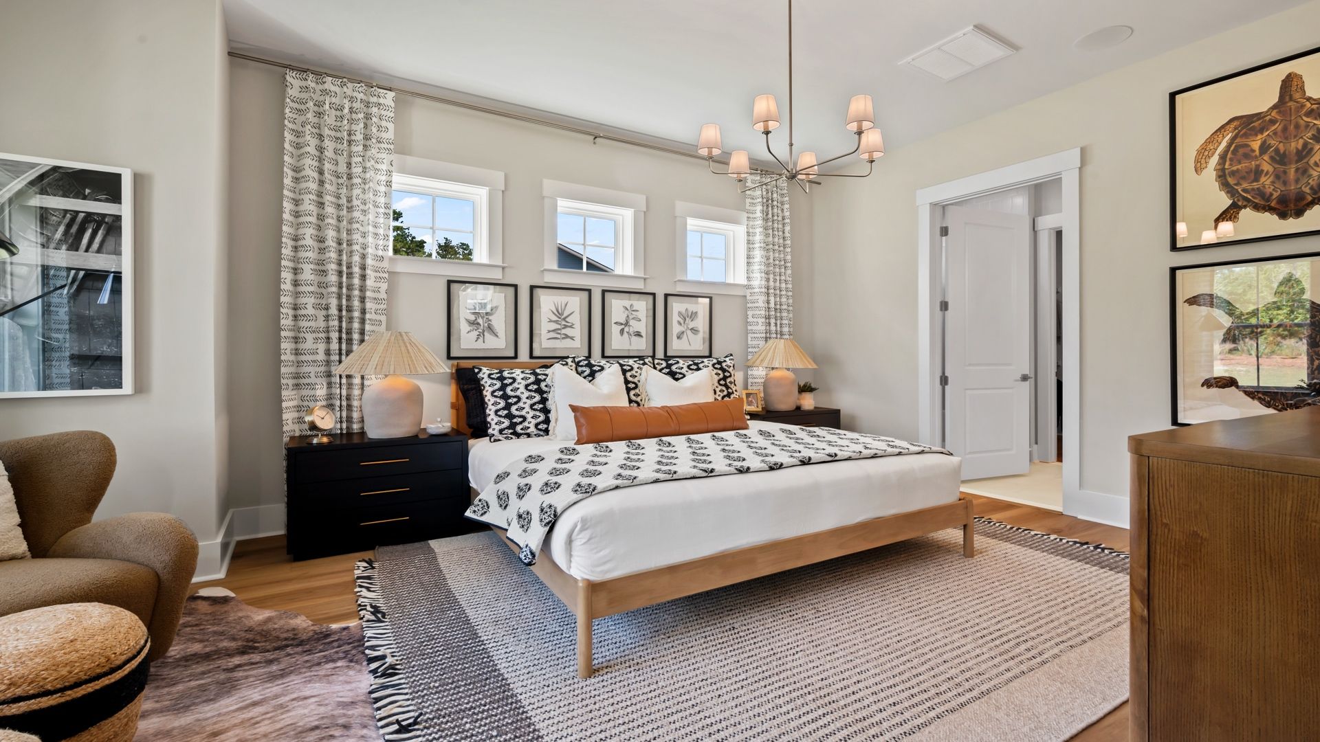 Relax in the Traveler’s bright primary bedroom, designed with comfort and style in mind.