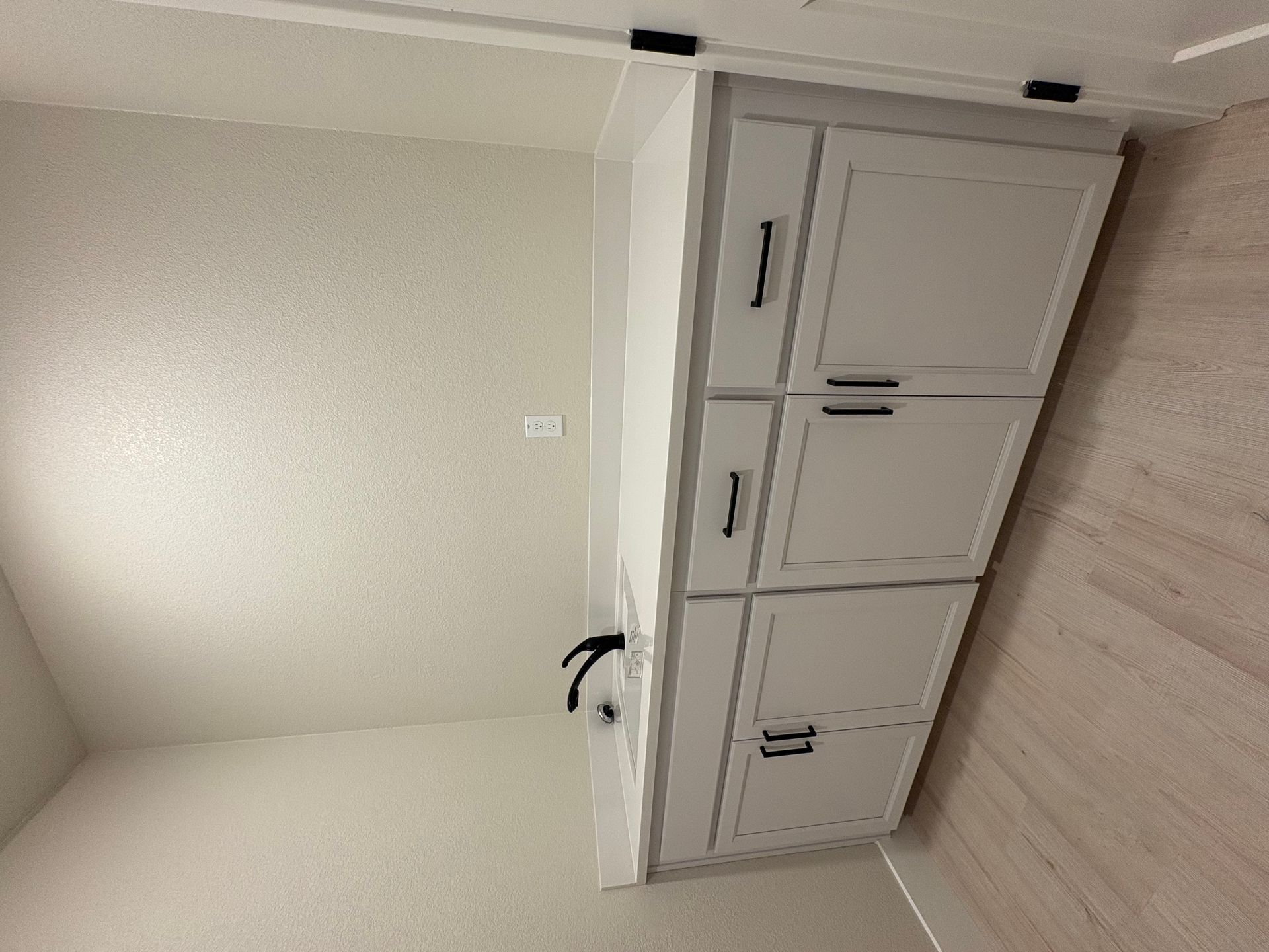 Laundry room with sink and lower cabinets