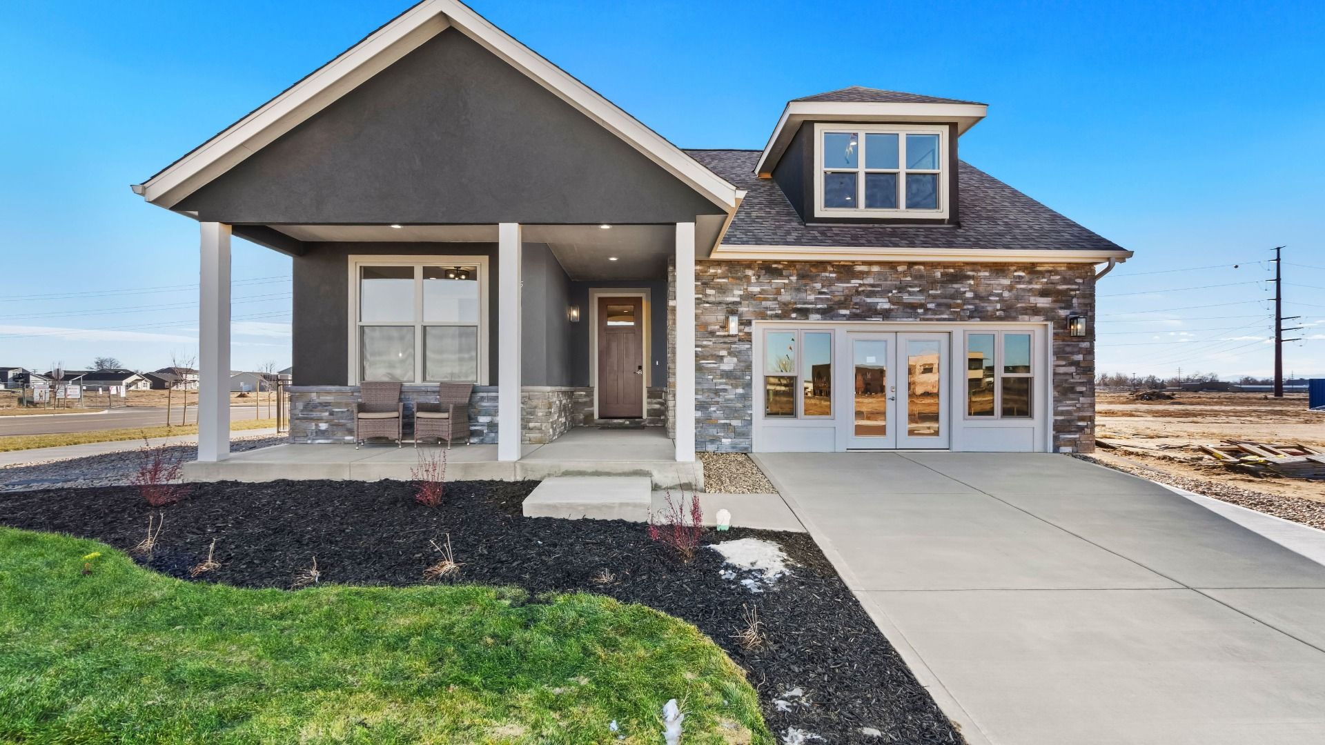 Portico - The Courtyards at Lupton Village: Fort Lupton, Colorado - Epcon Communities
