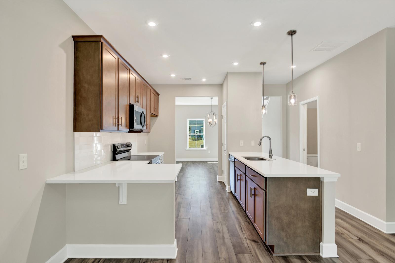 New Townhome Kitchen with Quartz Countertops and Bartop in Guyton GA