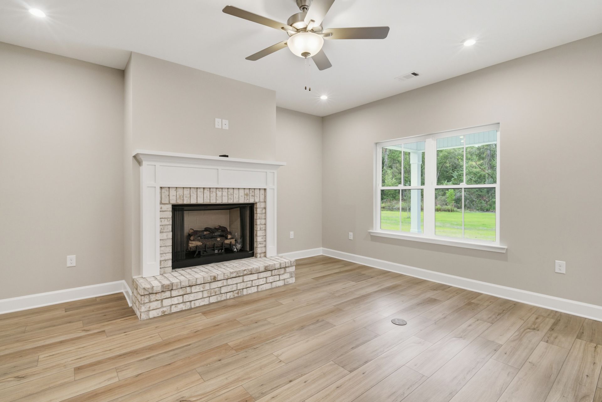 Harbor II Family Room with Fireplace and Rear Windows