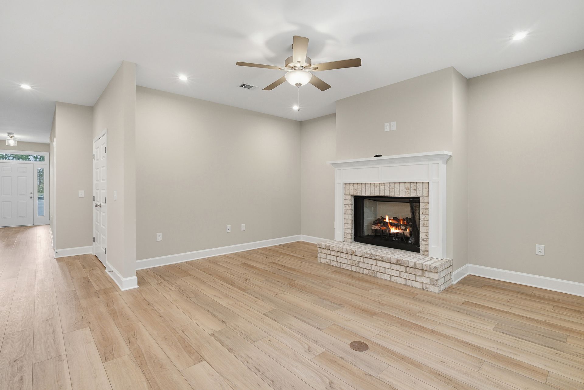 Harbor II Open Family Room with Brick Fireplace