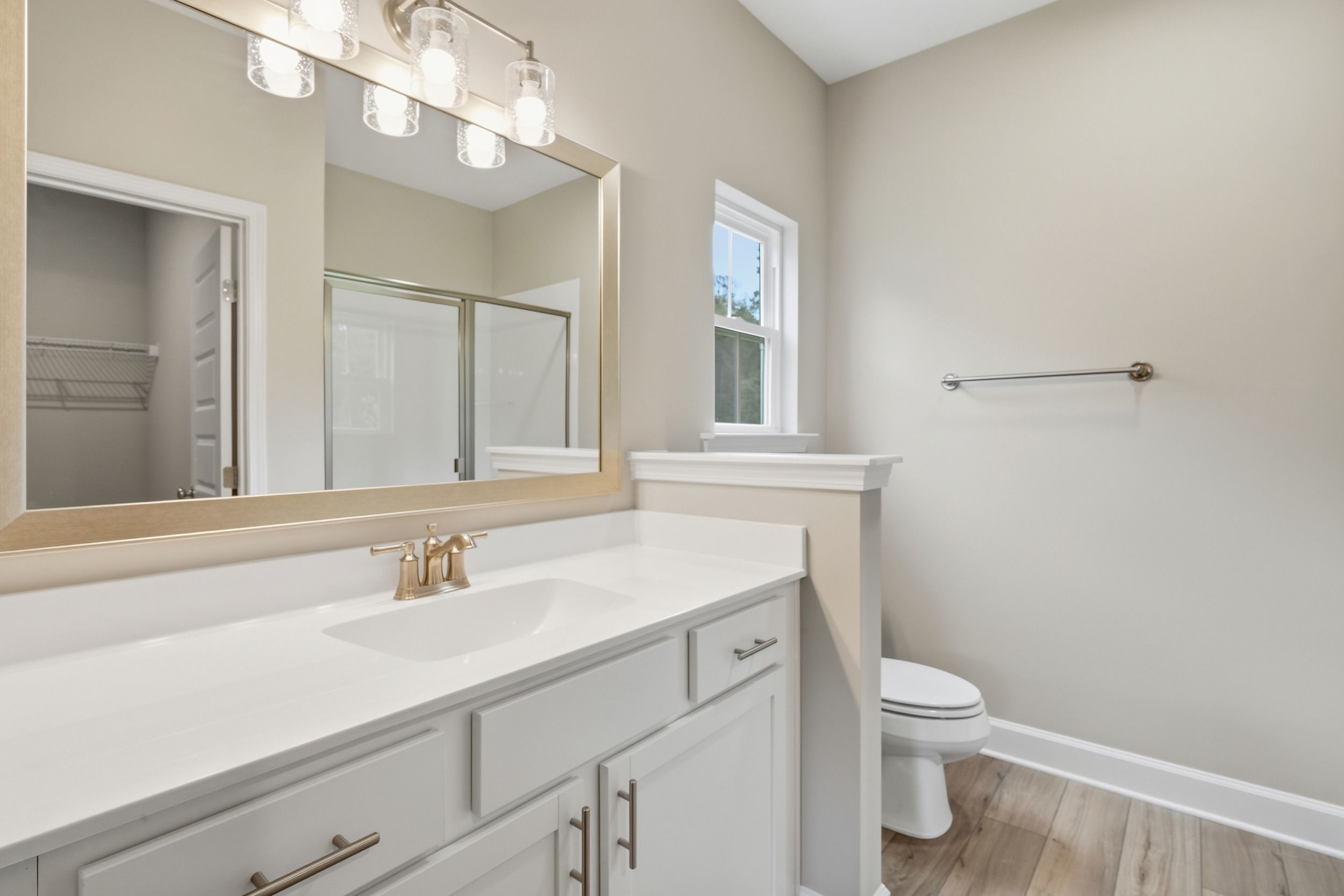 Harbor II Second Primary Bathroom with Framed Mirror and Vanity Lighting