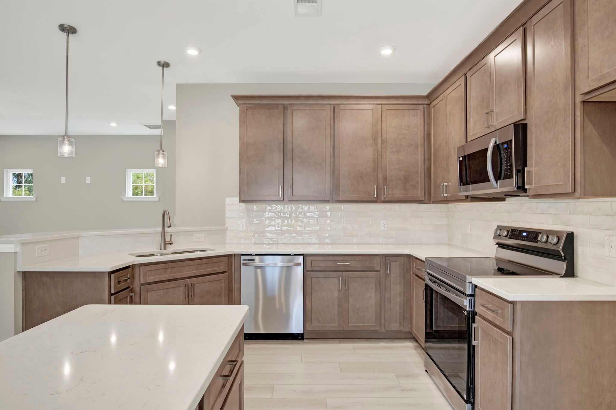 Aspen Plan Kitchen with Raised Bar and Island - Open Concept