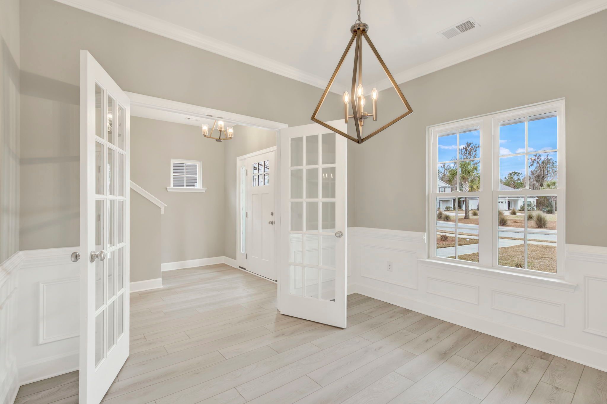 Aspen Plan Foyer and Dining Room with French Doors