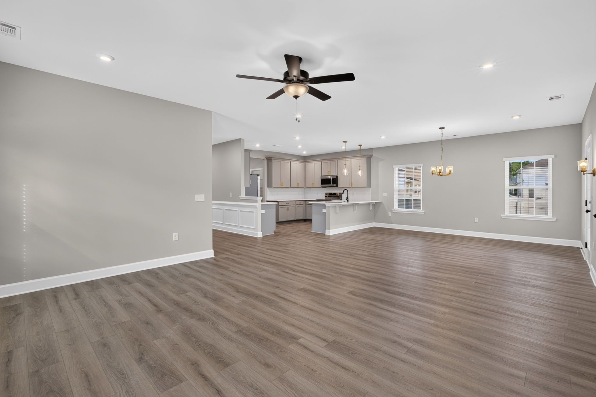 Open Living Room, Breakfast Area & Foyer Hallway at 245 James Drive – Dunham Marsh
