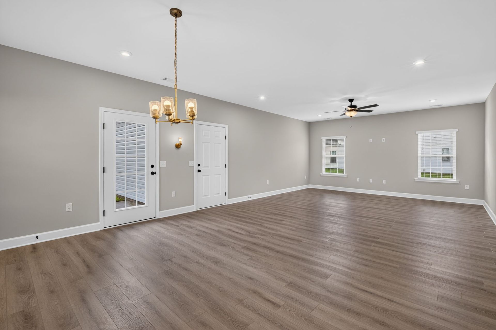 Living Room with Patio & Rear Garage Access at 245 James Drive – Dunham Marsh